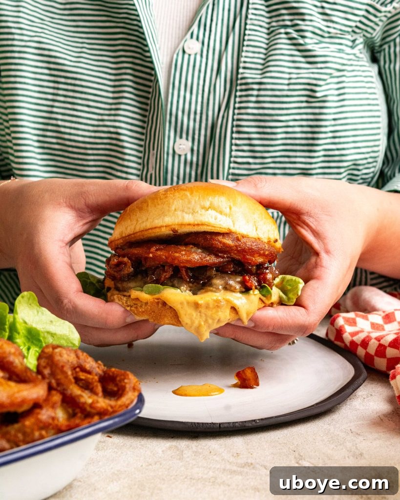 Crispy Onion Ring Burger 3 Close-up of burger ingredients, showcasing fresh produce and a rich bacon jam.