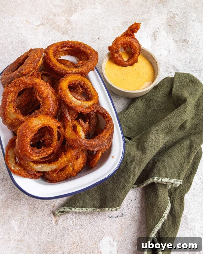 Crispy Onion Ring Burger 6 Crispy beer-battered onion rings stacked high.