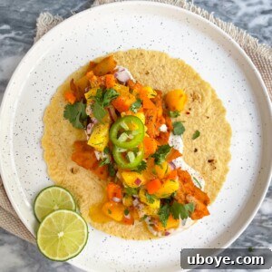 Weeknight Chicken Tacos with Mango Salsa on a white plate