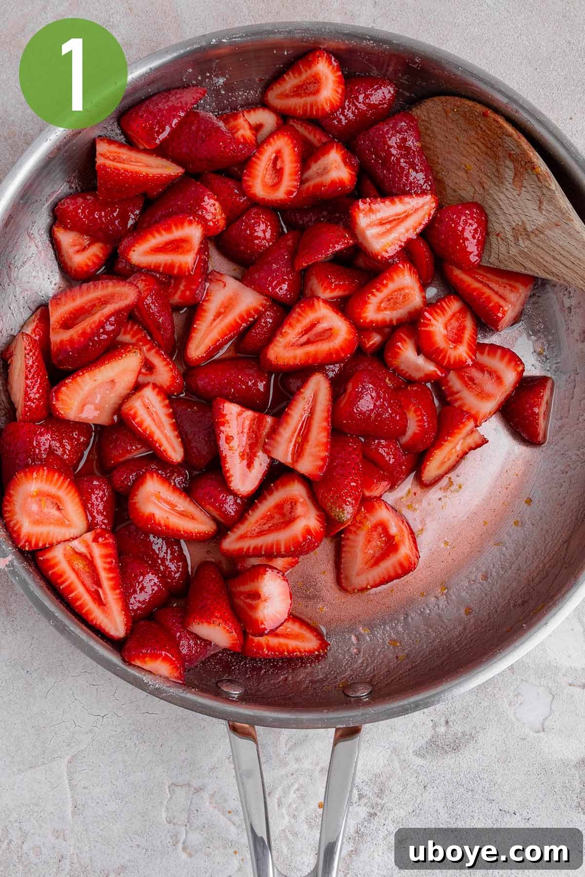 Strawberry Cream Dream Cake 3 Freshly sliced strawberries macerating in a skillet with sugar and lemon juice.