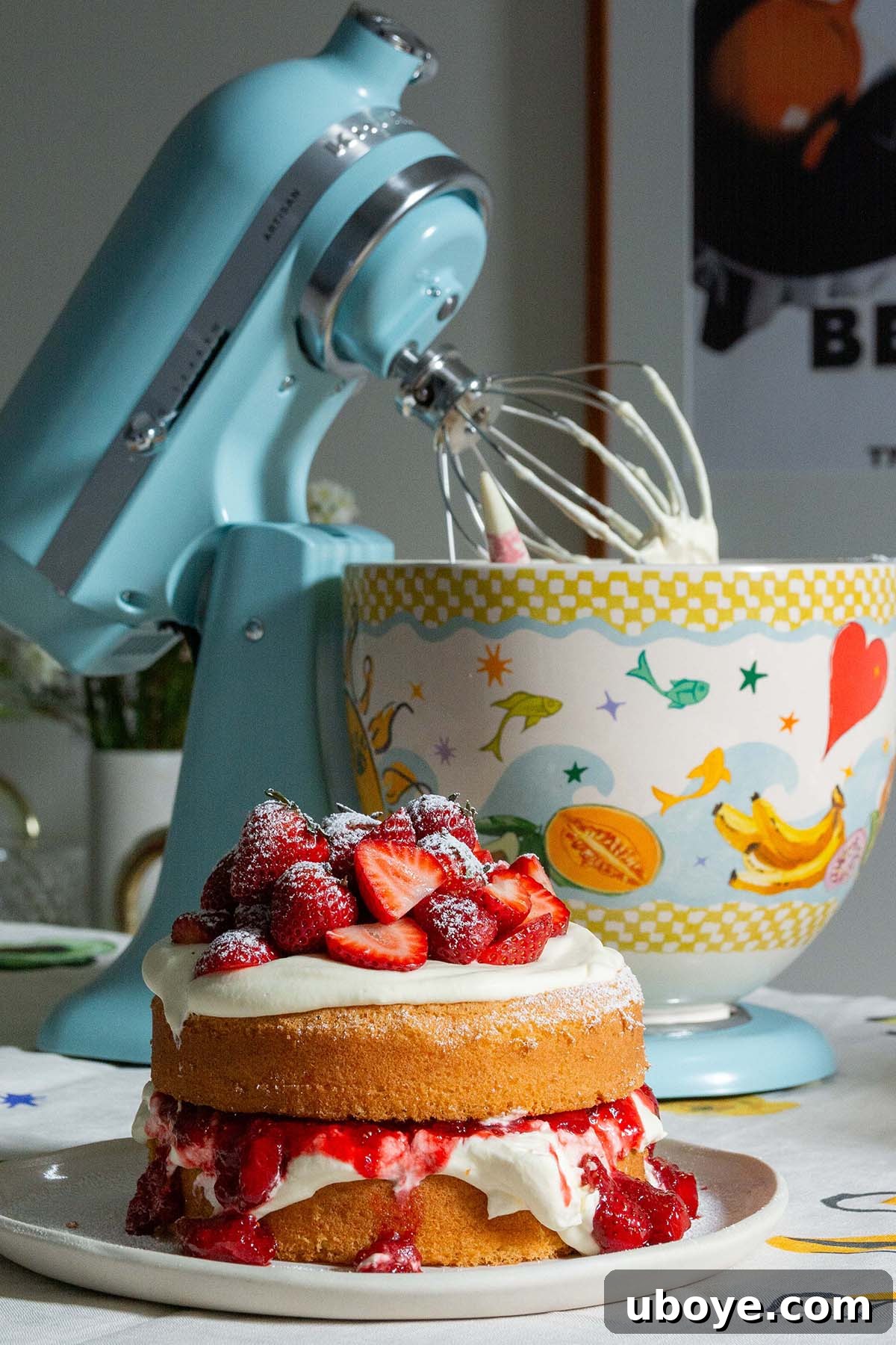 Strawberry Cream Dream Cake 8 Strawberry jam cake displayed beautifully next to a stylish stand mixer.