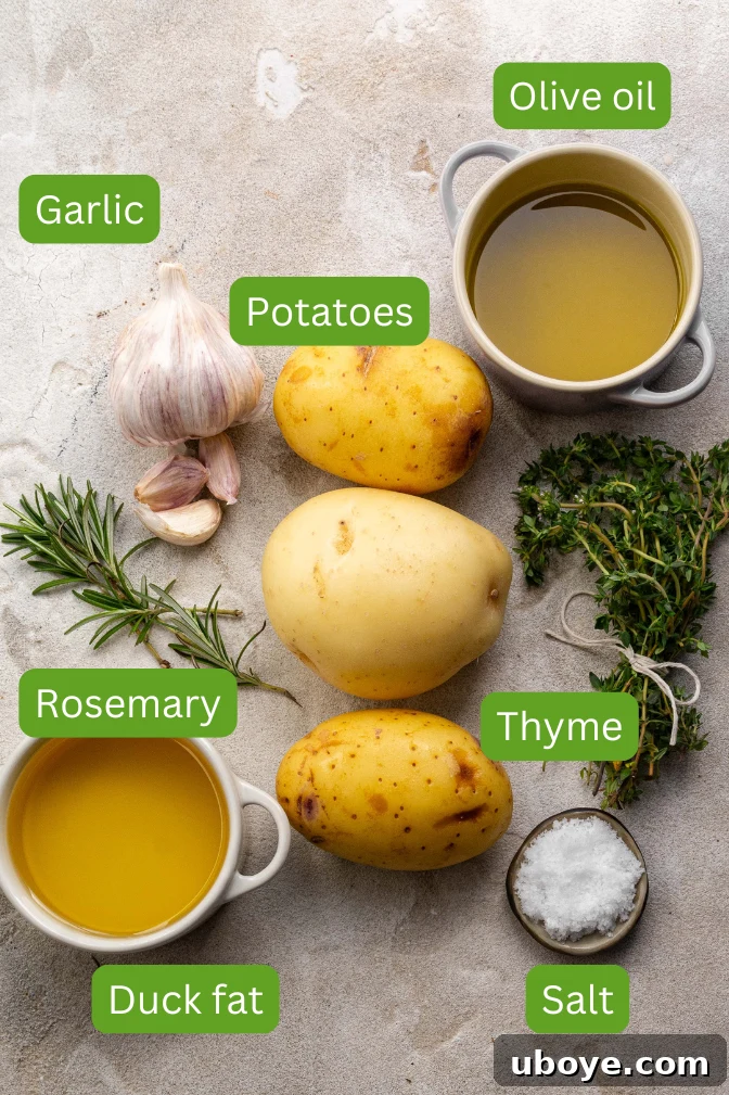 An array of fresh ingredients for crispy duck fat roasted potatoes, including potatoes, duck fat, olive oil, garlic, rosemary, and salt, artfully arranged for preparation.