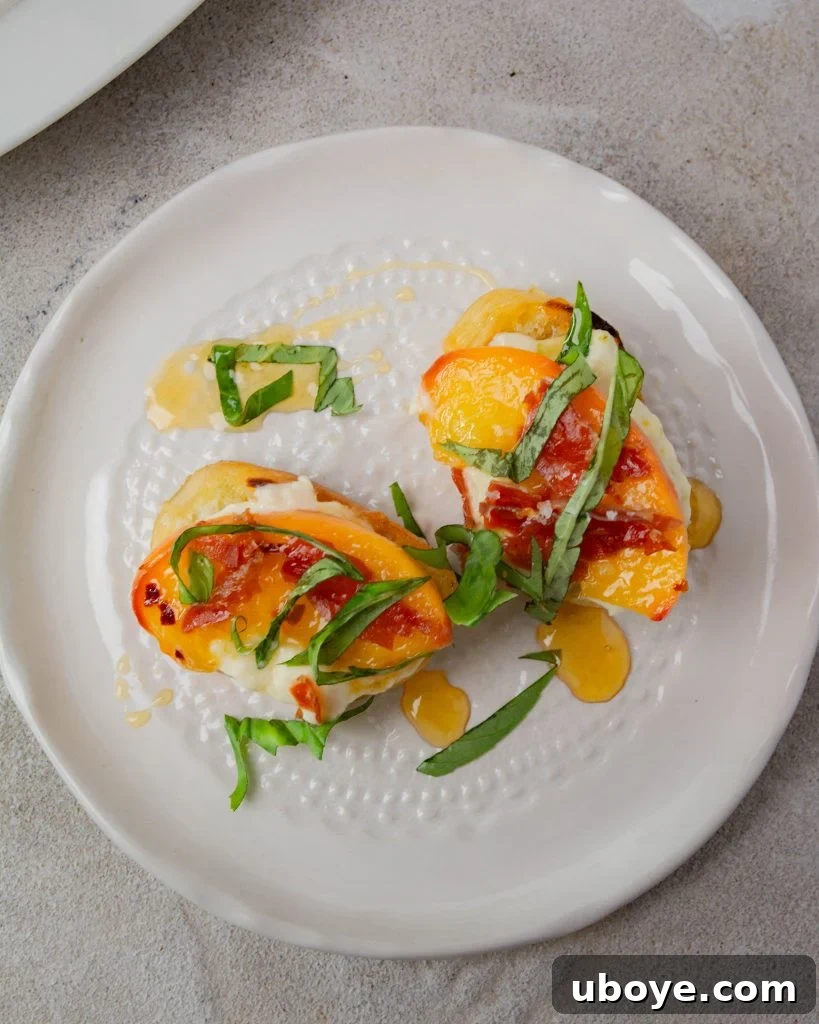 Multiple servings of peach and crispy prosciutto crostini on a wooden board
