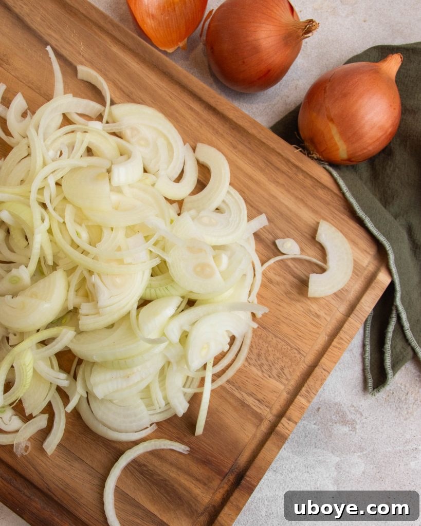 Golden Caramelized Onion Sheet Pan Pizza 5 Caramelized onions simmering slowly in a pan