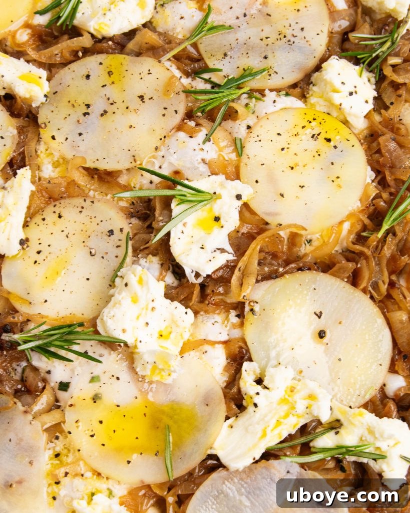 Golden Caramelized Onion Sheet Pan Pizza 8 Assembled pizza with caramelized onions, potatoes, and cheeses, ready for baking