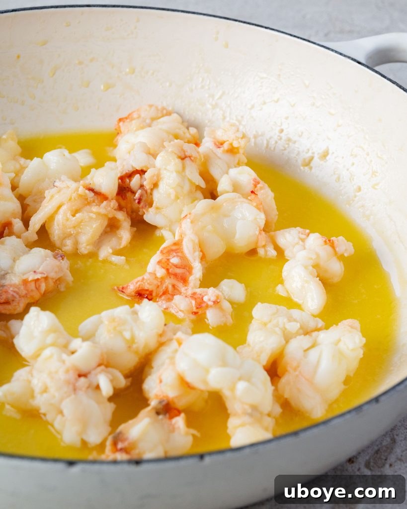 A close-up of butter-poached lobster chunks.