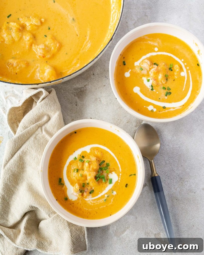 A perfectly portioned bowl of lobster bisque, garnished and ready to enjoy.