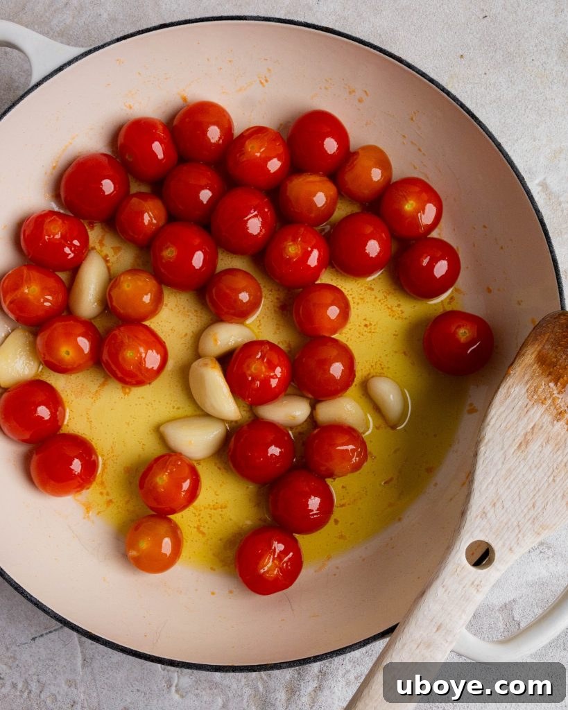 Rustic Tomato Garlic Beans 7 Fresh garlic cloves and ripe cherry tomatoes, key ingredients for the recipe.
