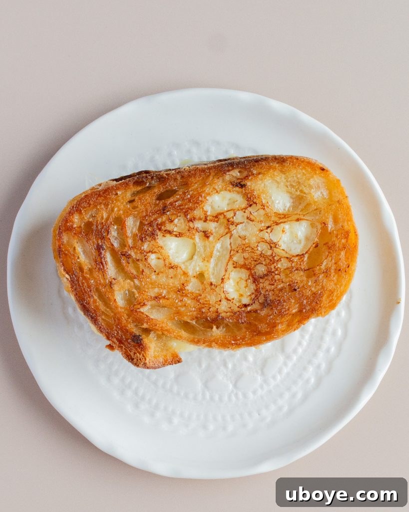 Creamy Cauliflower Delight 8 Golden brown grilled cheese sandwich cut in half, ready to be served.