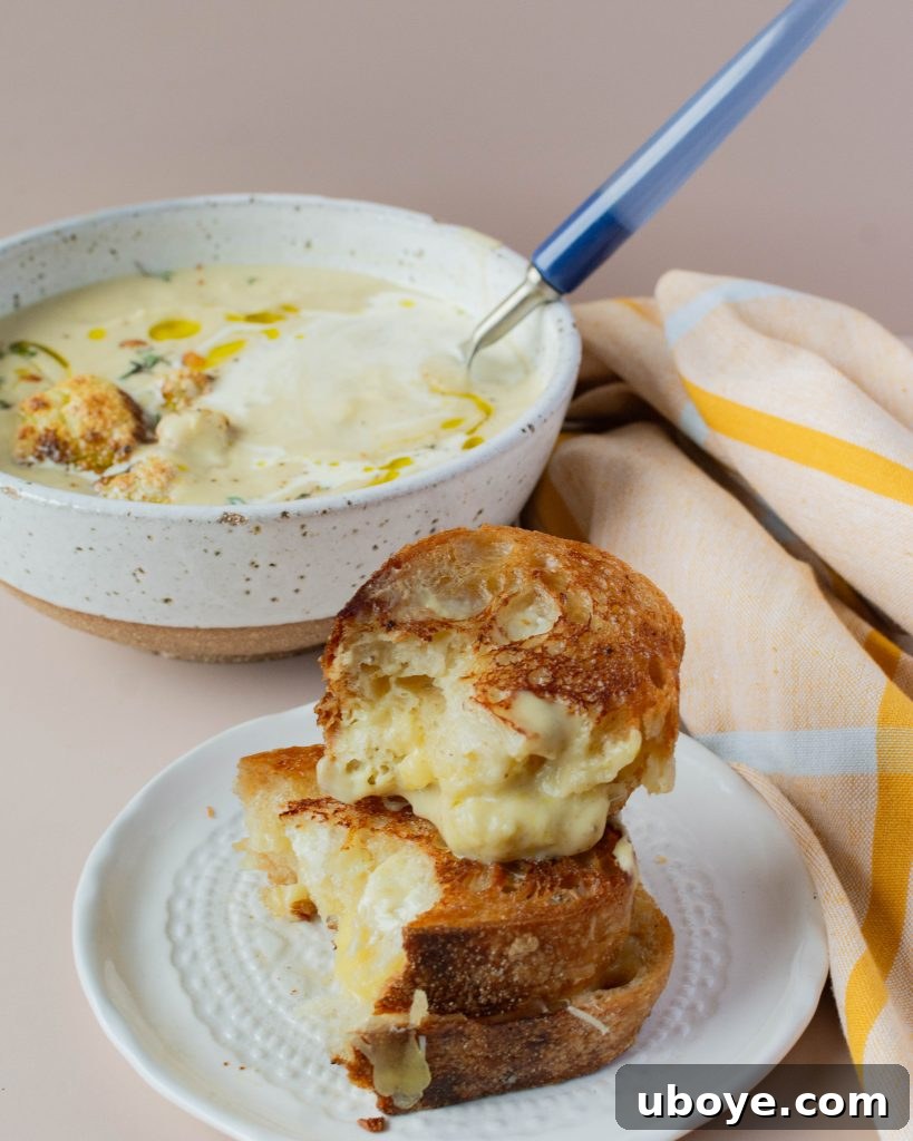 Creamy Cauliflower Delight 10 Overhead shot of creamy cauliflower soup with a grilled cheese sandwich.