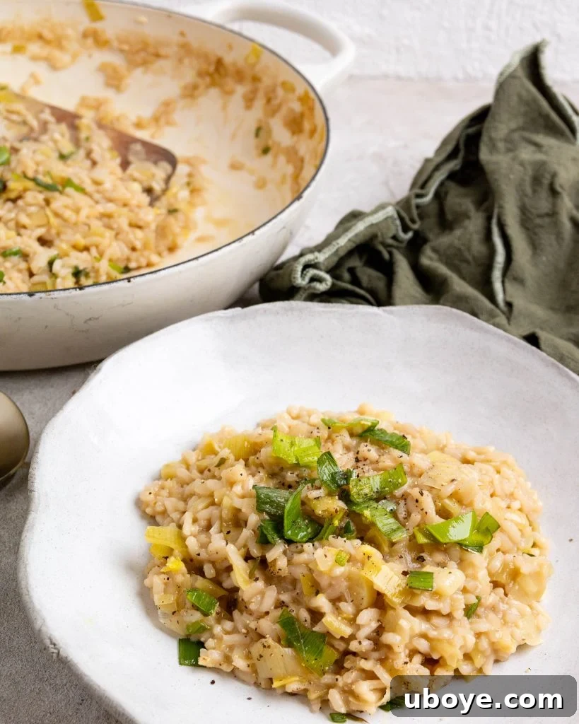 Creamy Leek Risotto 8 A bowl of creamy leek risotto with a green towel nearby, showcasing the comfort and freshness of the dish.