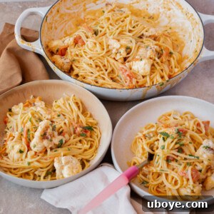 Velvet Lobster Pasta 11 Creamy lobster pasta, presented with fresh herbs, ready to be enjoyed.
