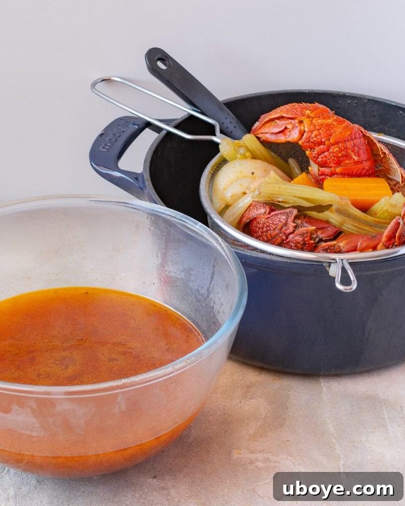 Velvet Lobster Pasta 6 Lobster shells in a large pot, surrounded by aromatic vegetables, for making stock.