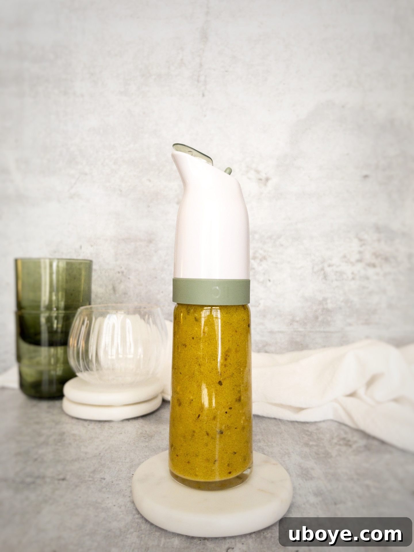 60-Second Champagne Vinaigrette 2 Homemade Champagne Vinaigrette in a glass bottle, ready to serve over a fresh salad
