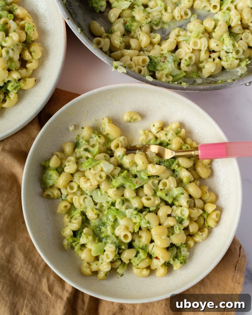 Effortless One-Pot Broccoli Pasta 2 Creamy broccoli pasta served in a bowl, garnished with fresh herbs