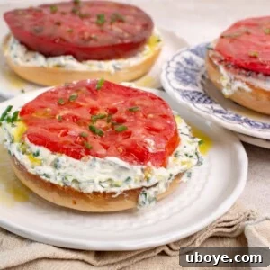 Cream cheese bagel with garlic confit and heirloom tomato