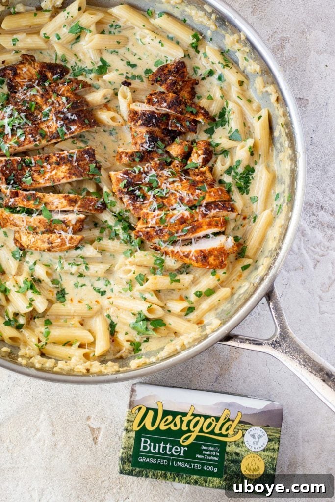 Single Skillet Creamy Chicken Alfredo 5 Alfredo sauce thickening in a pan, showing its creamy texture