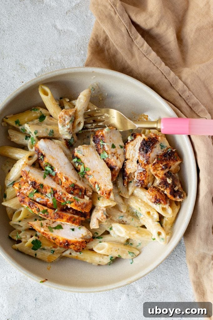 Single Skillet Creamy Chicken Alfredo 9 Plated creamy chicken alfredo garnished with fresh parsley and parmesan