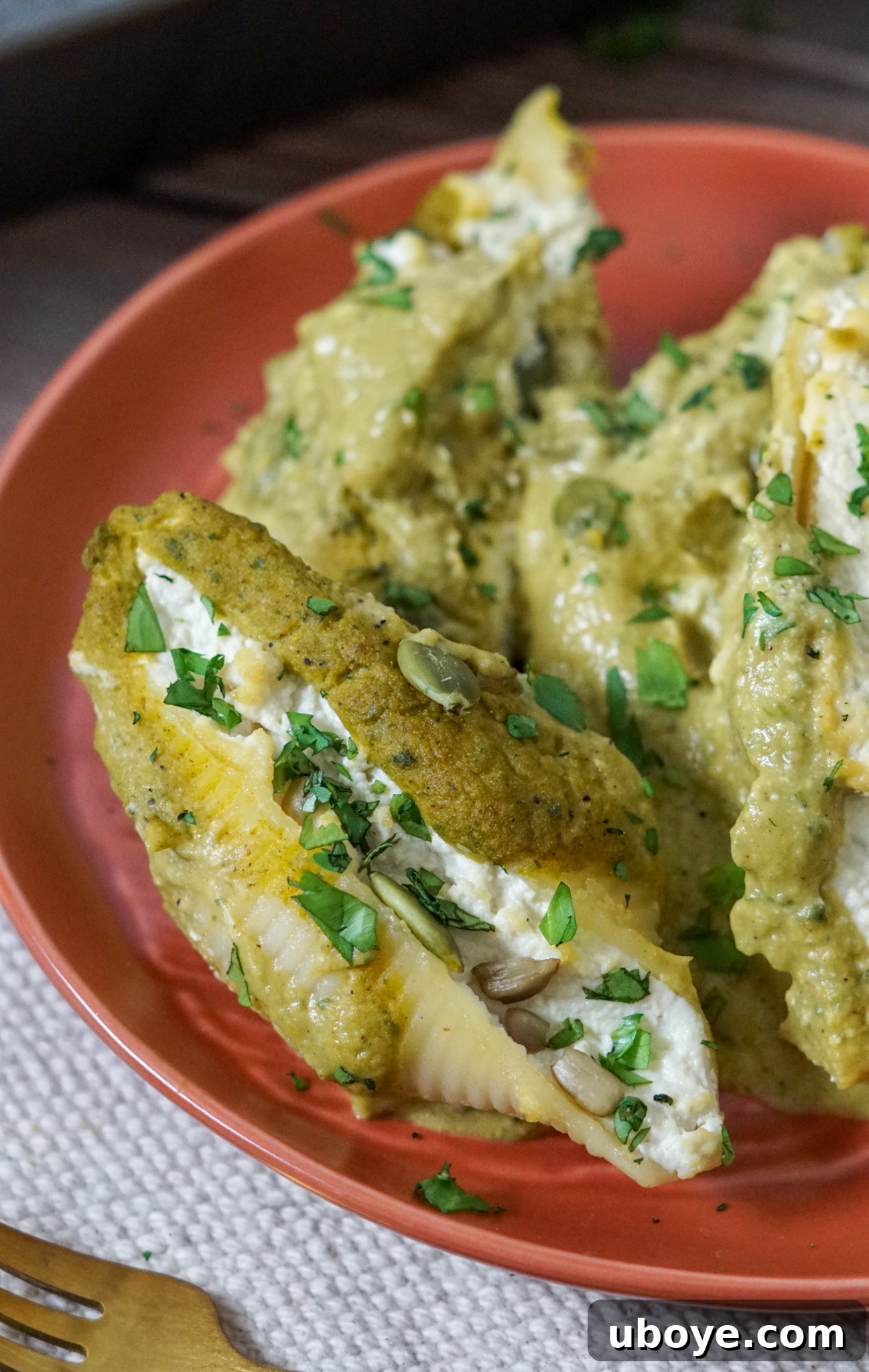 Hearty Pumpkin Poblano Stuffed Shells baked in a casserole dish