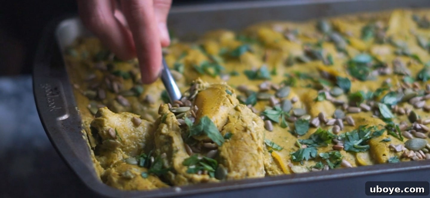 Baked Pumpkin Poblano Stuffed Shells garnished with fresh cilantro and seeds