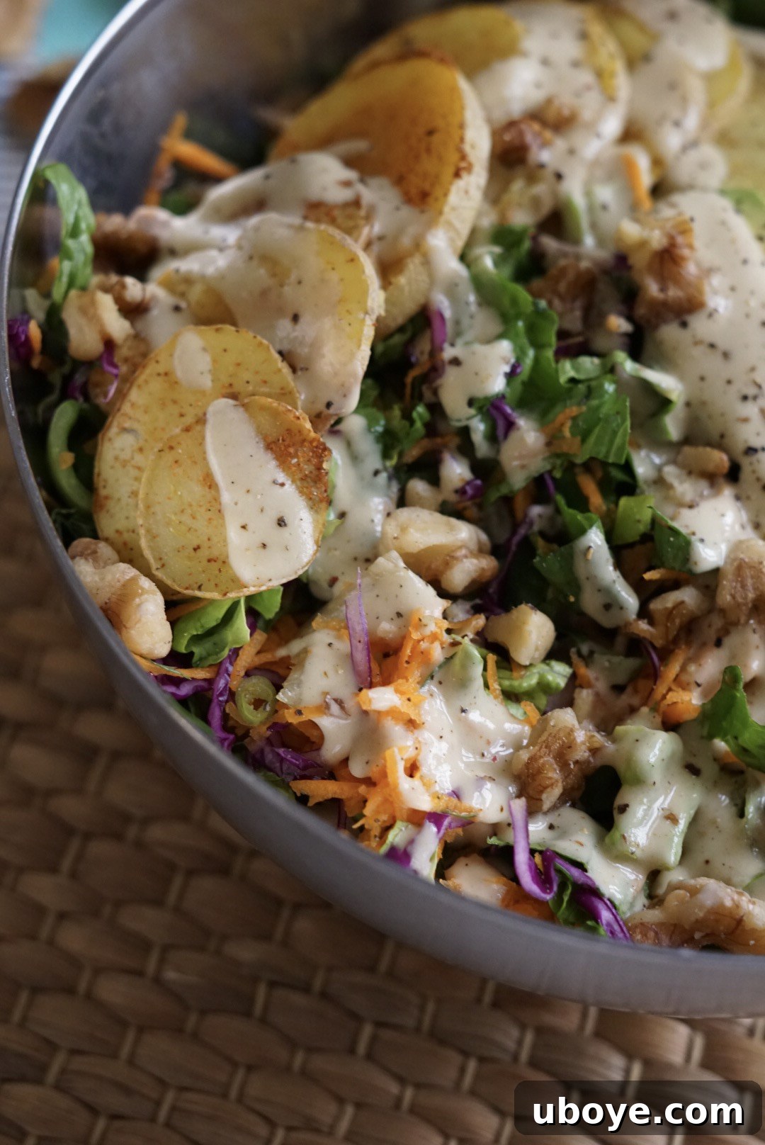 A close-up shot of a bowl of the finished vegan maple mustard dressing, smooth and ready to use.