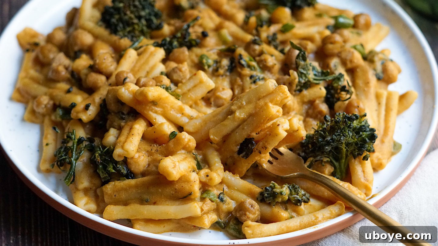 Warm Spiced Pumpkin Pasta with Charred Broccolini and Crispy Chickpeas 3 Close-up of the creamy vegan pumpkin sauce simmering in a pan, showing its rich texture.