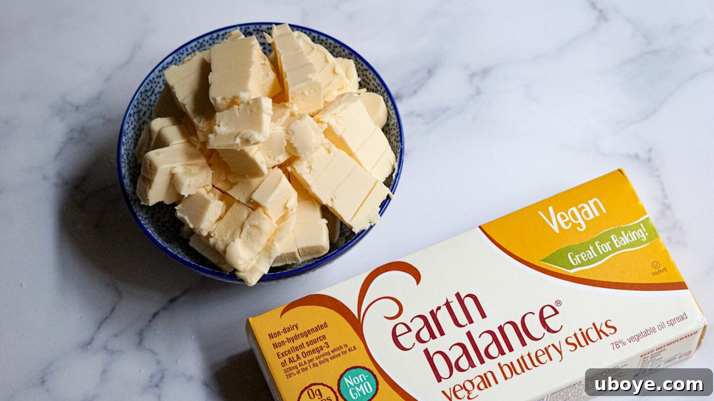 Timeless Vegan Apple Pie 5 cold vegan butter sticks on a marble countertop