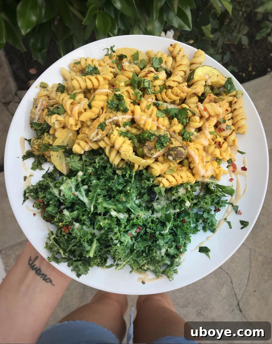 Effortless Kale Delight 5 A vibrant, finished Simple Kale Salad, ready to be served, showcasing all its delightful textures and colors.
