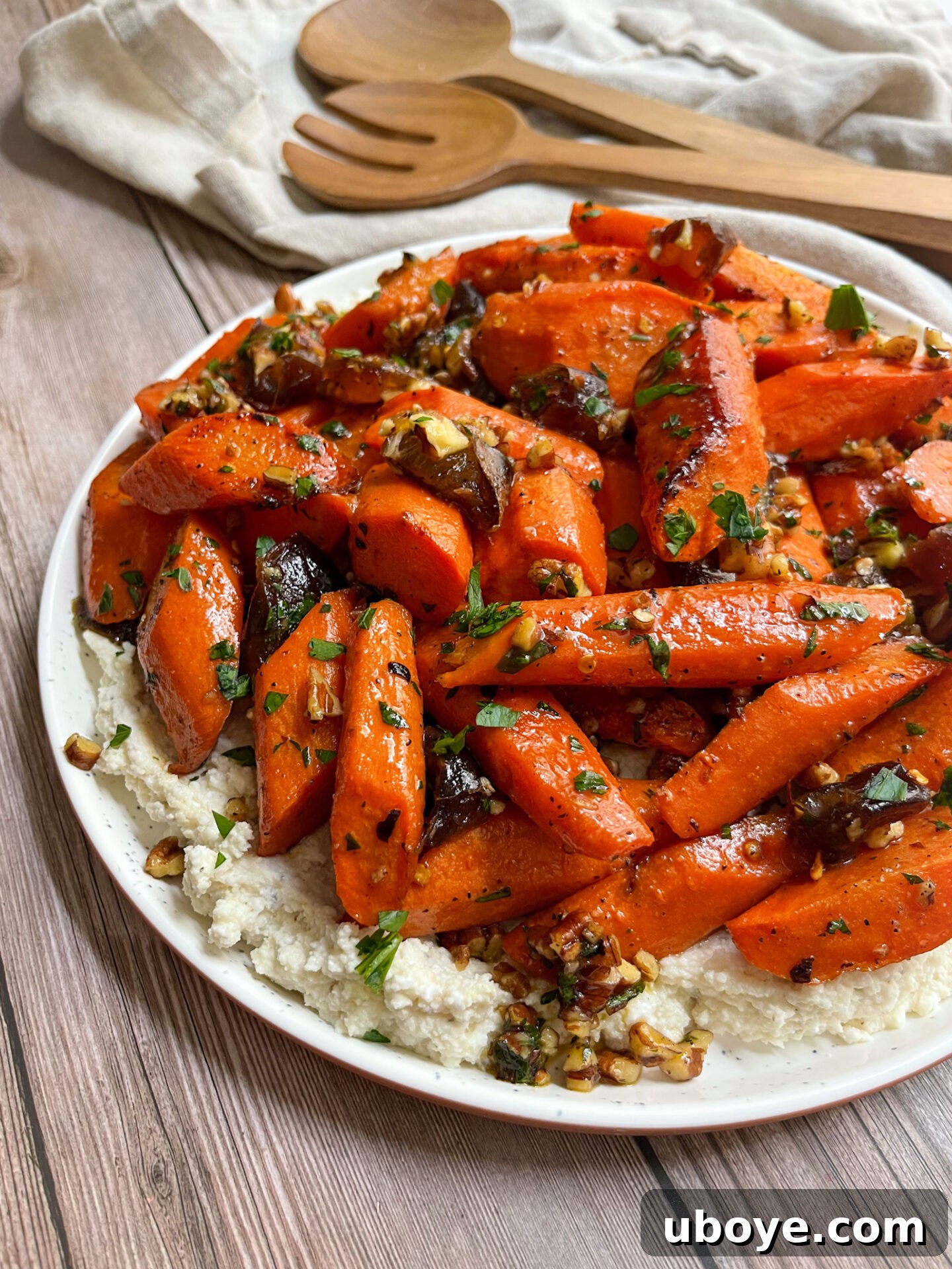 Close-up of fresh, vibrant carrots, some sliced, ready for roasting.
