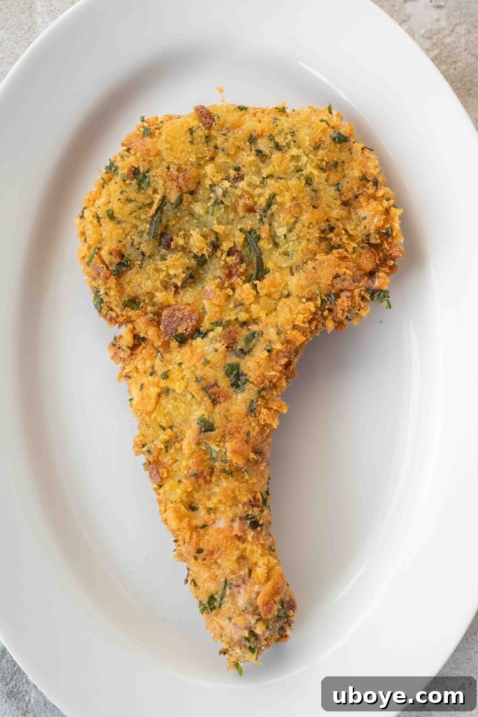 Golden Crusted Pork Cutlets 9 Cooking crumbed pork cutlets in a pan