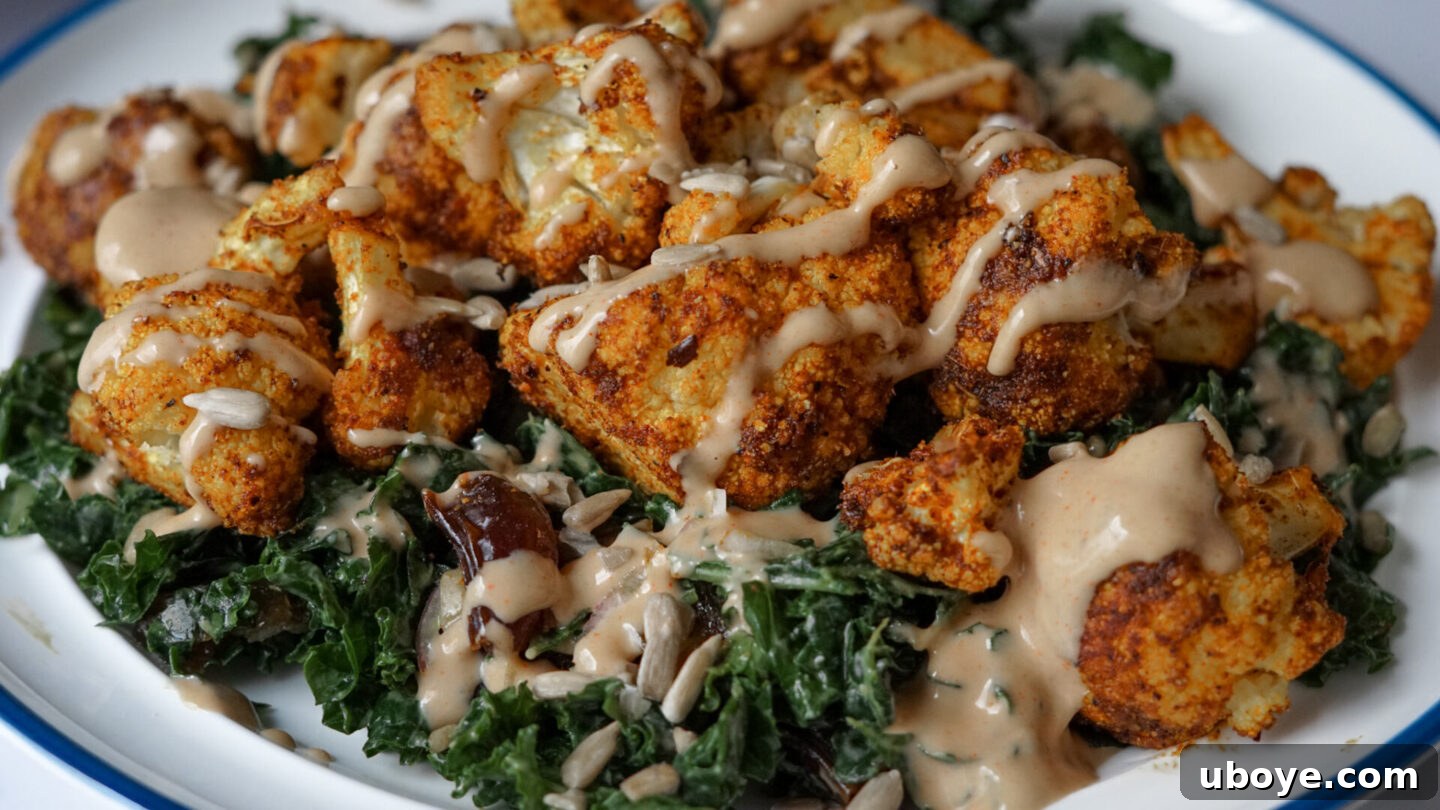Mixing kale salad with dressing