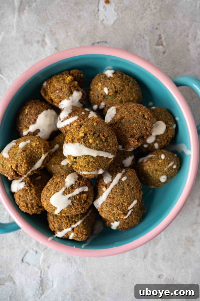 Crispy golden brown falafel balls arranged on a serving plate.
