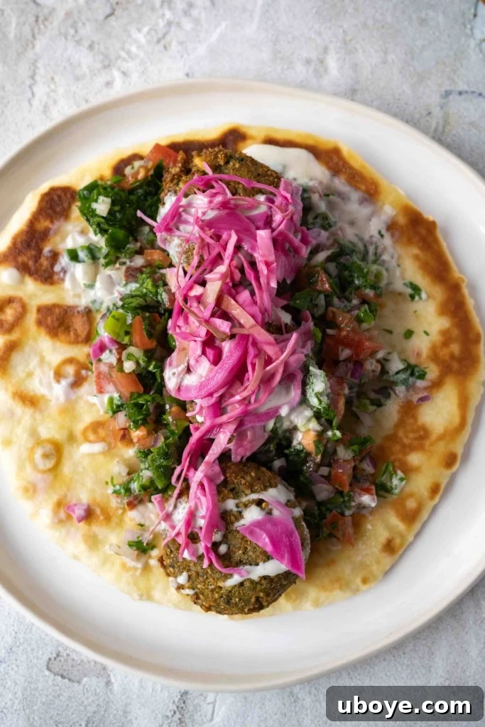 A close-up of a falafel wrap, showcasing the delicious fillings.