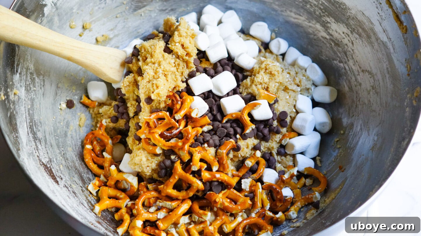 Freshly baked Vegan Pretzel S'mores Cookies on a baking sheet, cooling and ready to be enjoyed.