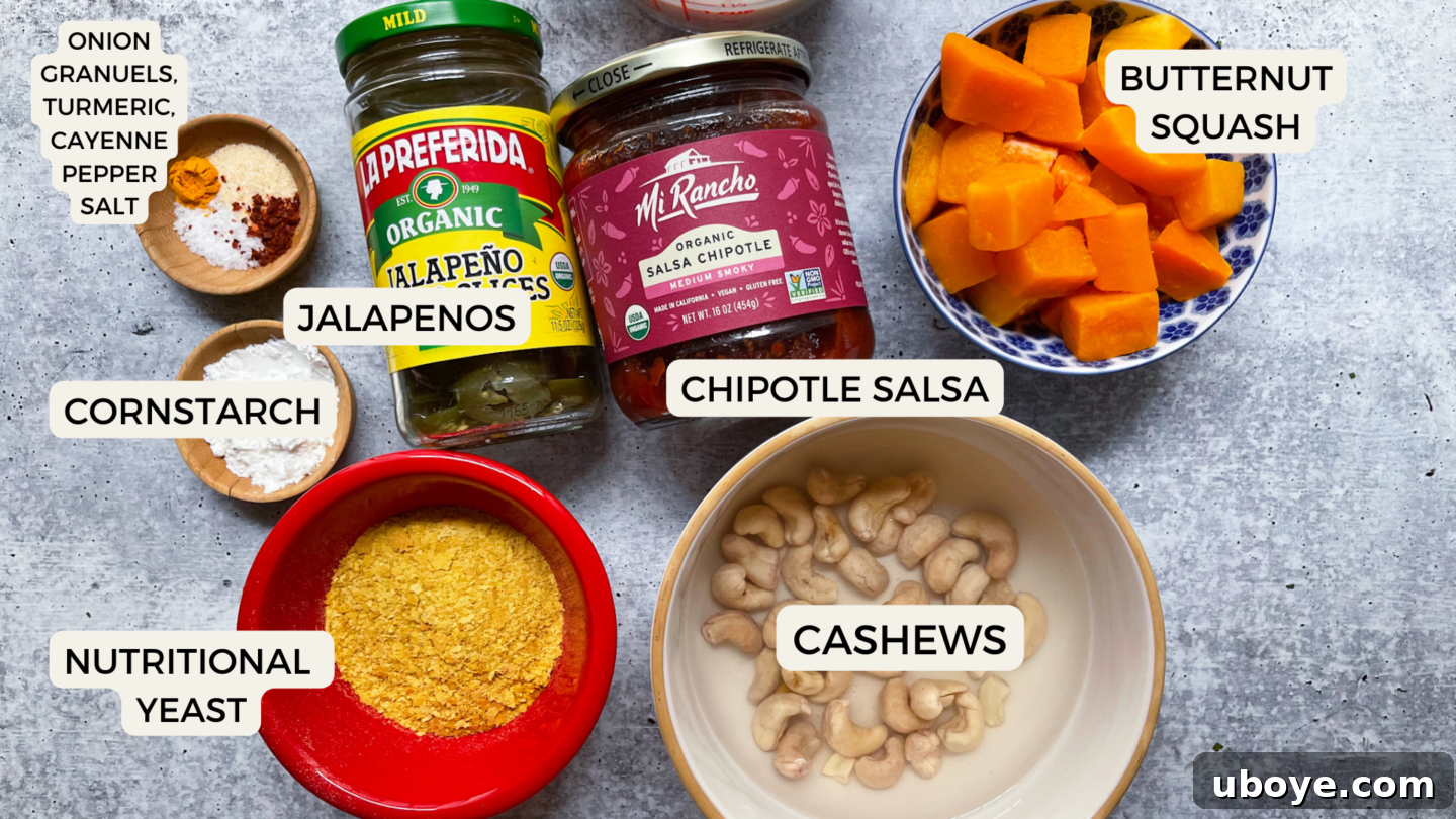 Velvety Plant-Based Queso 4 A flat lay photograph showcasing all the fresh and pantry ingredients needed for the plant-based queso dip.
