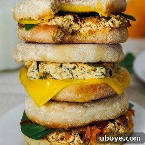 A perfectly prepared vegan breakfast sandwich with a round tofu frittata.
