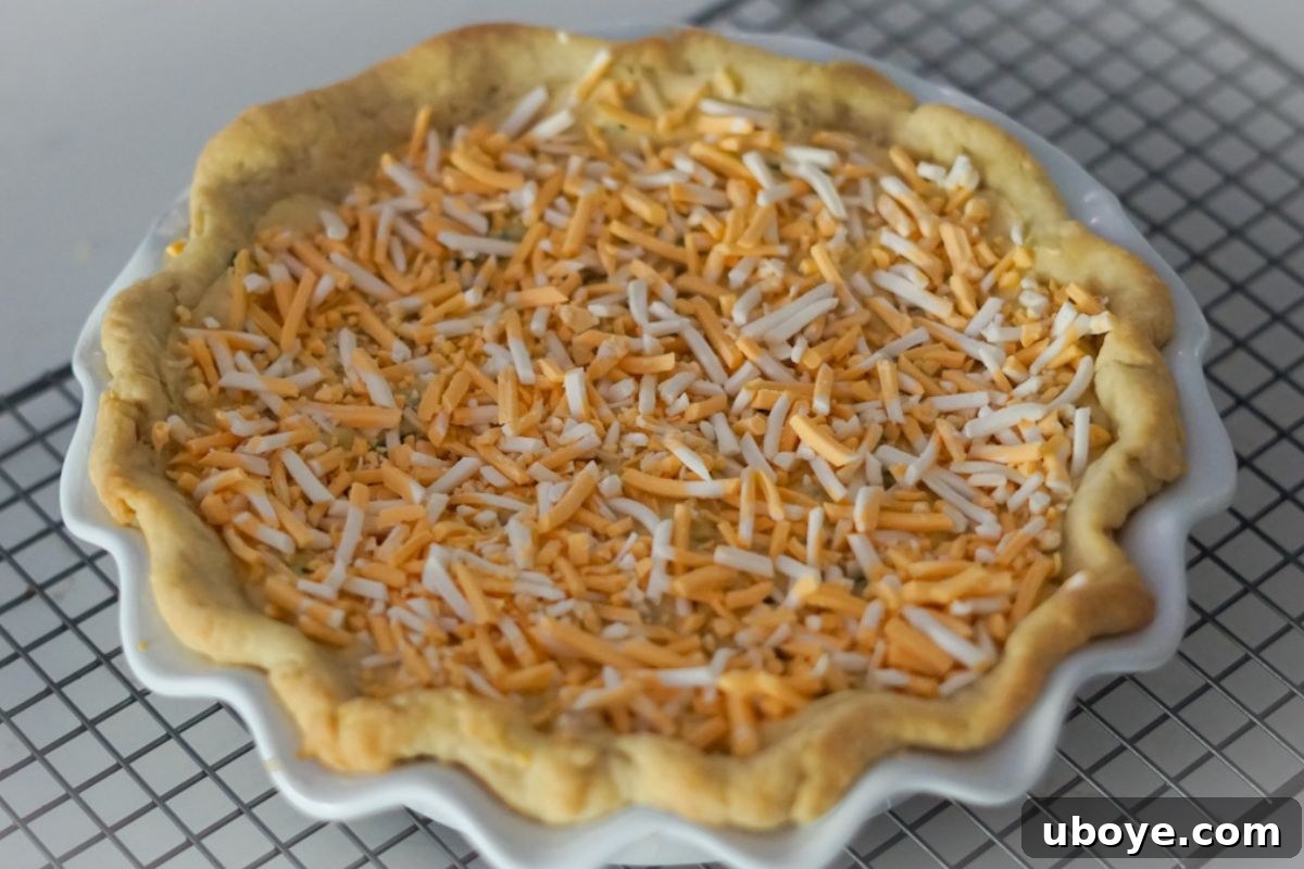 A fully baked vegan spinach quiche, golden and ready to slice