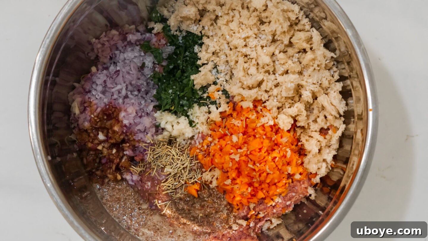 Assortment of fresh vegan meatloaf ingredients, including vegan ground meat, diced vegetables, bread, and spices, laid out on a kitchen counter.