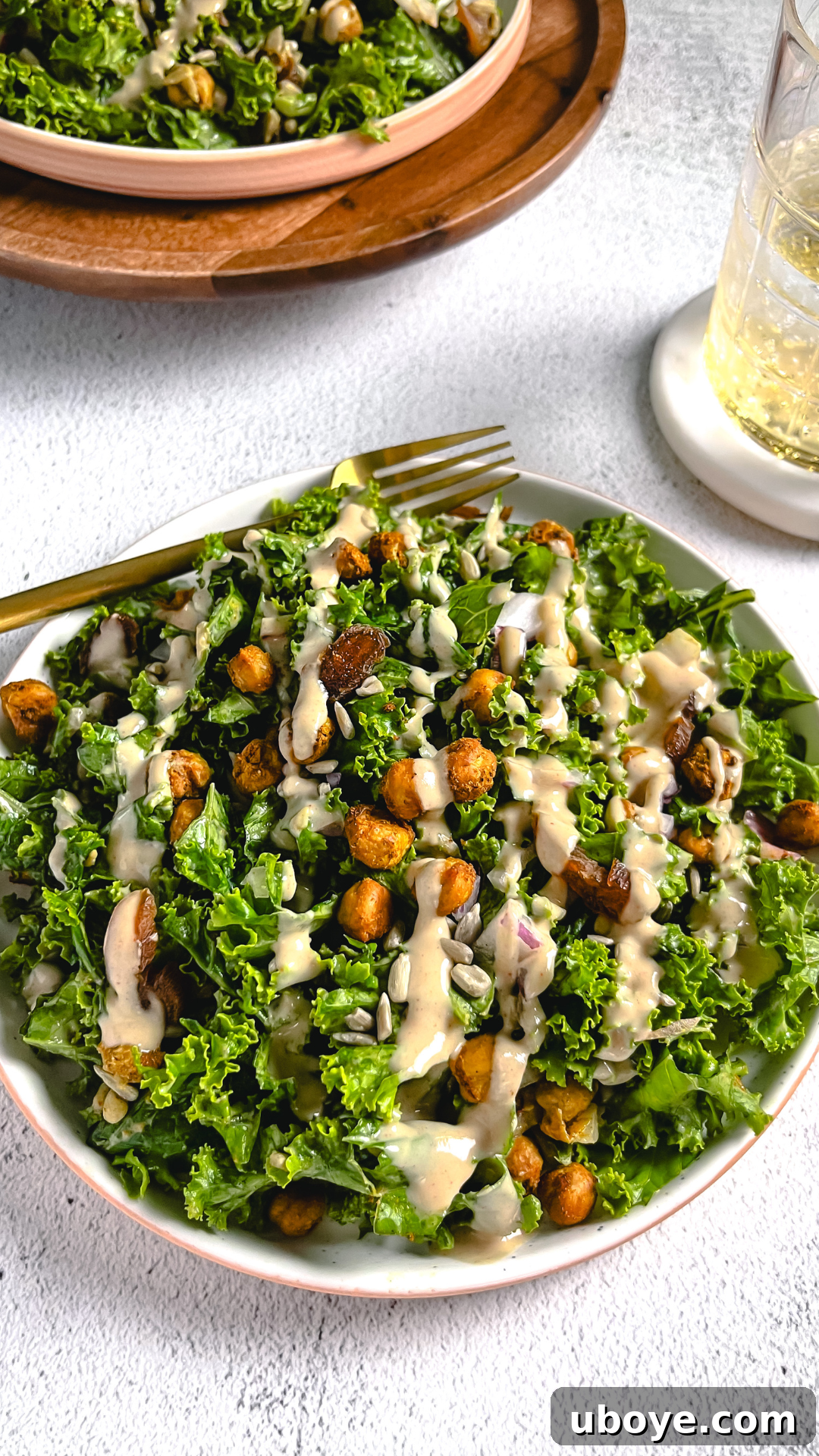 Air Fryer Chickpea Salad with Tahini Dressing on an Our Place plate, showcasing crispy chickpeas and fresh ingredients.