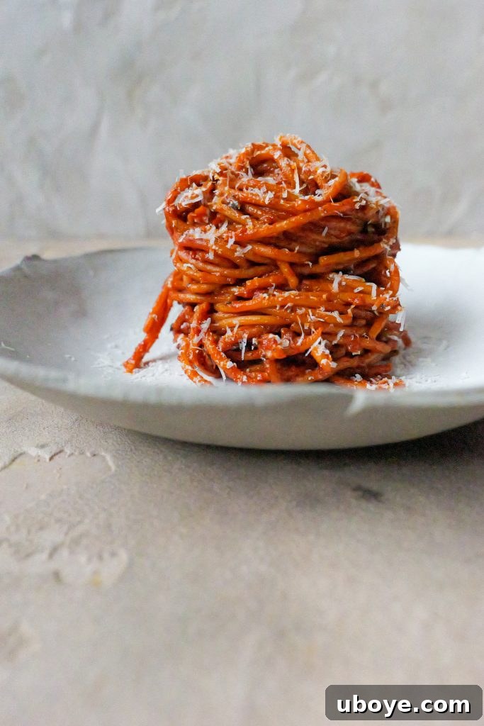 A serving of Pasta alla'Assassina garnished with fresh herbs