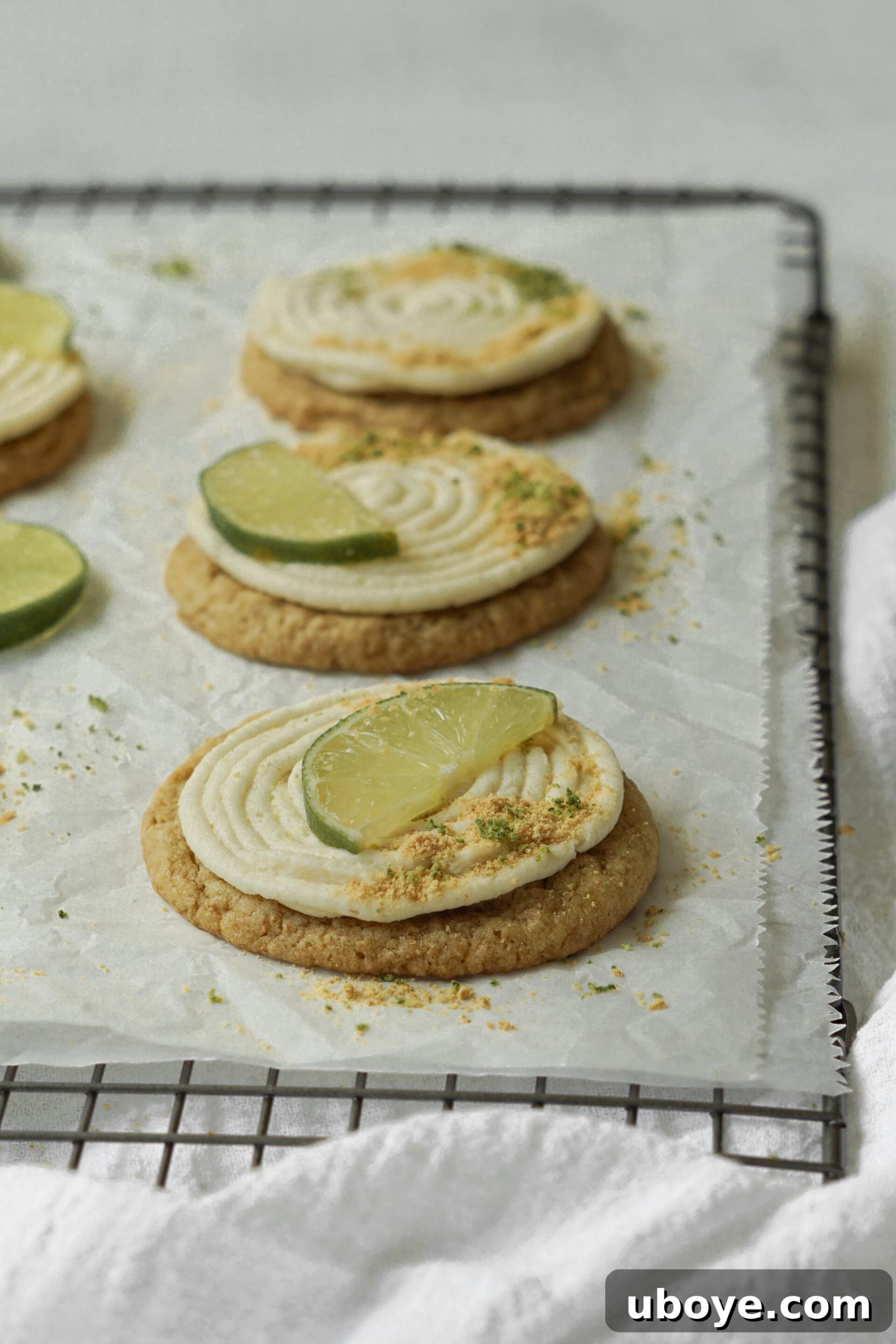 Close-up of a Key Lime Pie Cheesecake Cookie with a perfect swirl of frosting