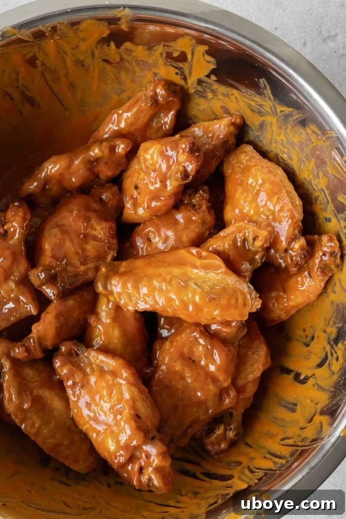 Crispy Baked Buffalo Wings 11 Freshly baked buffalo wings tossed in sauce, garnished with parsley