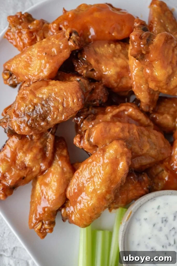 Crispy Baked Buffalo Wings 4 Platter of oven baked buffalo wings with dipping sauce and fresh celery