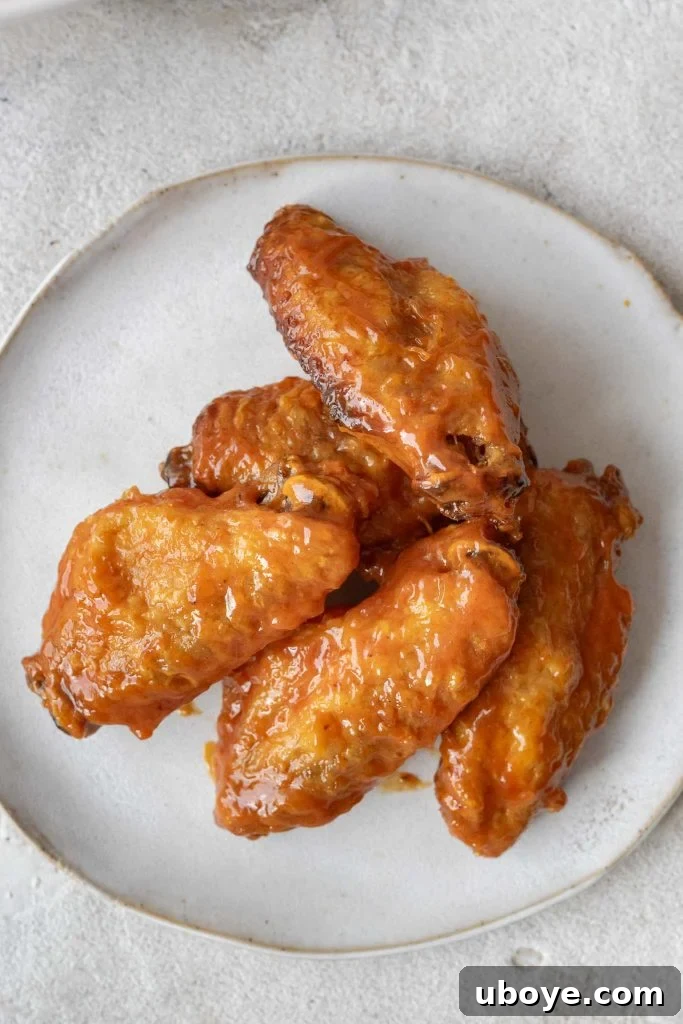 Crispy Baked Buffalo Wings 6 A basket of crispy oven baked Buffalo wings with a side of ranch dip