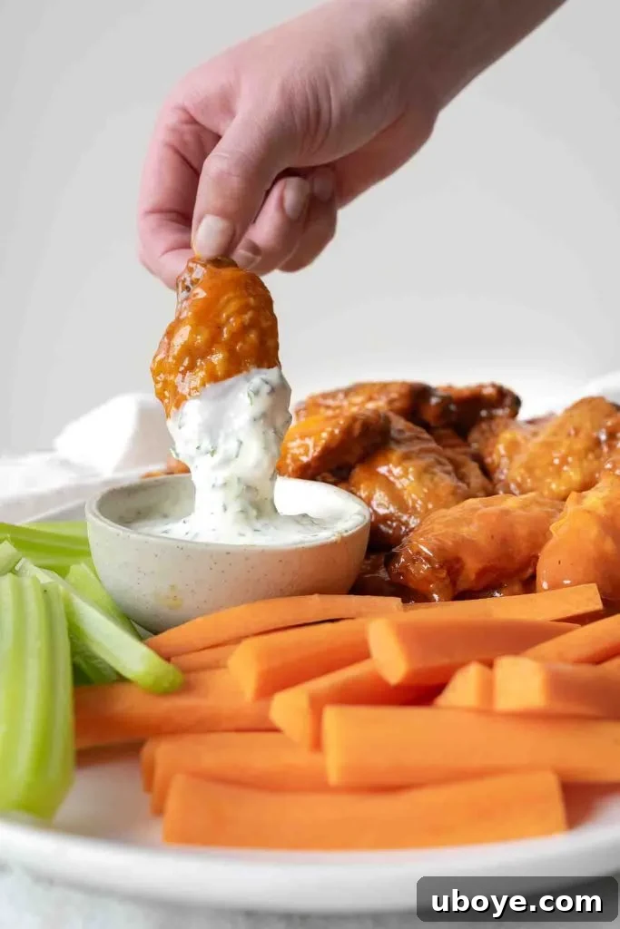 Crispy Baked Buffalo Wings 10 Crispy oven baked chicken wings on a wire rack after baking