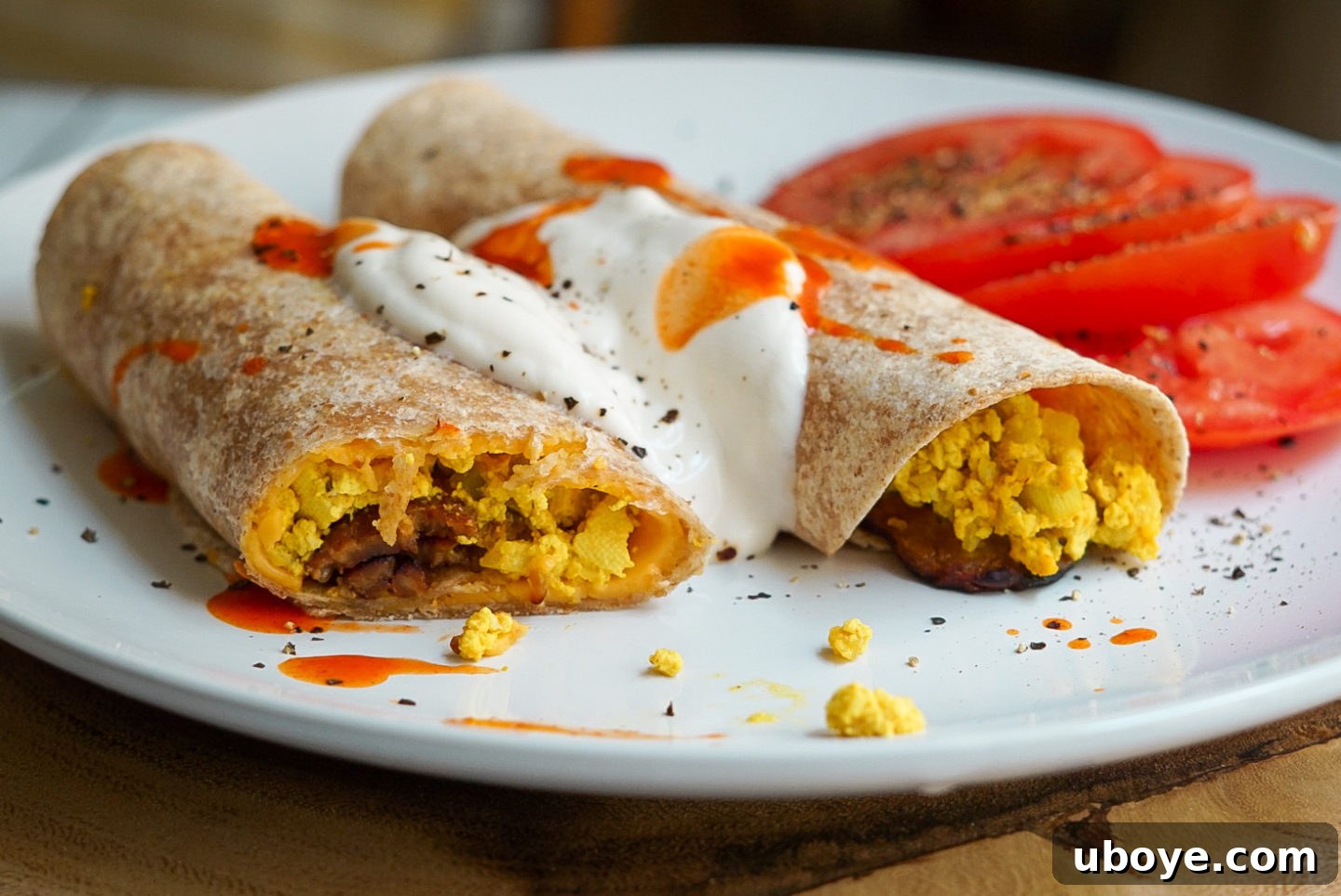 Crispy vegan cheddar bacon breakfast taquitos with dipping sauce.