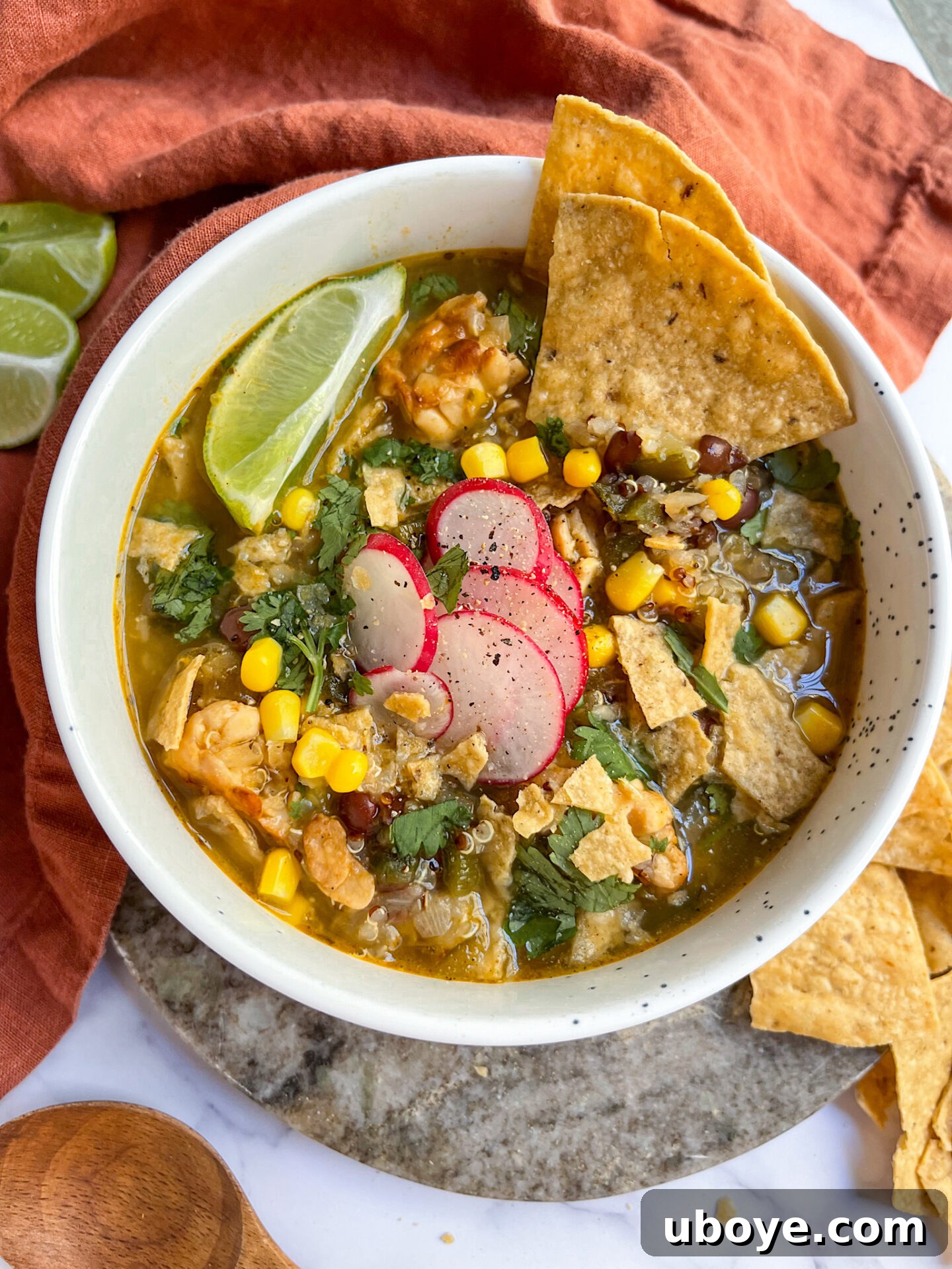 A robust bowl of green quinoa chili, packed with vegetables and flavor.
