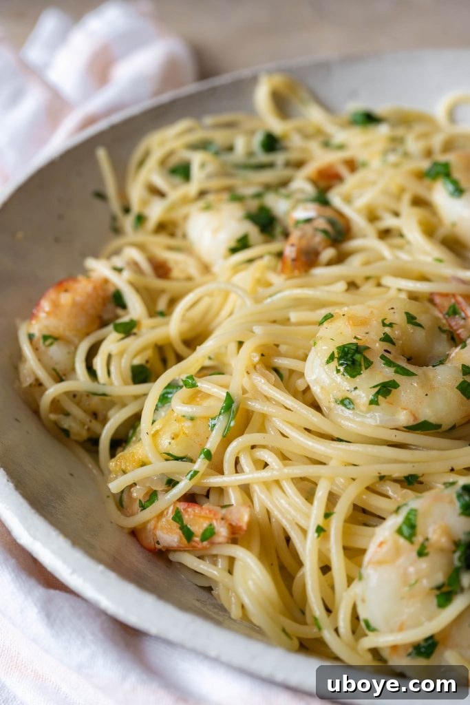 Close-up of fresh prawns, shallots, and garlic cloves, ready for cooking
