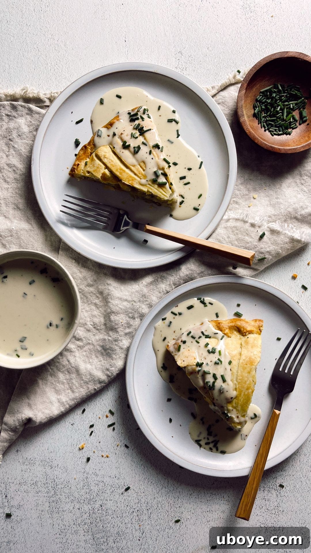 Close-up shot of the flaky pastry crust of the Vegan Potato Pithivier, showing the scalloped edges.