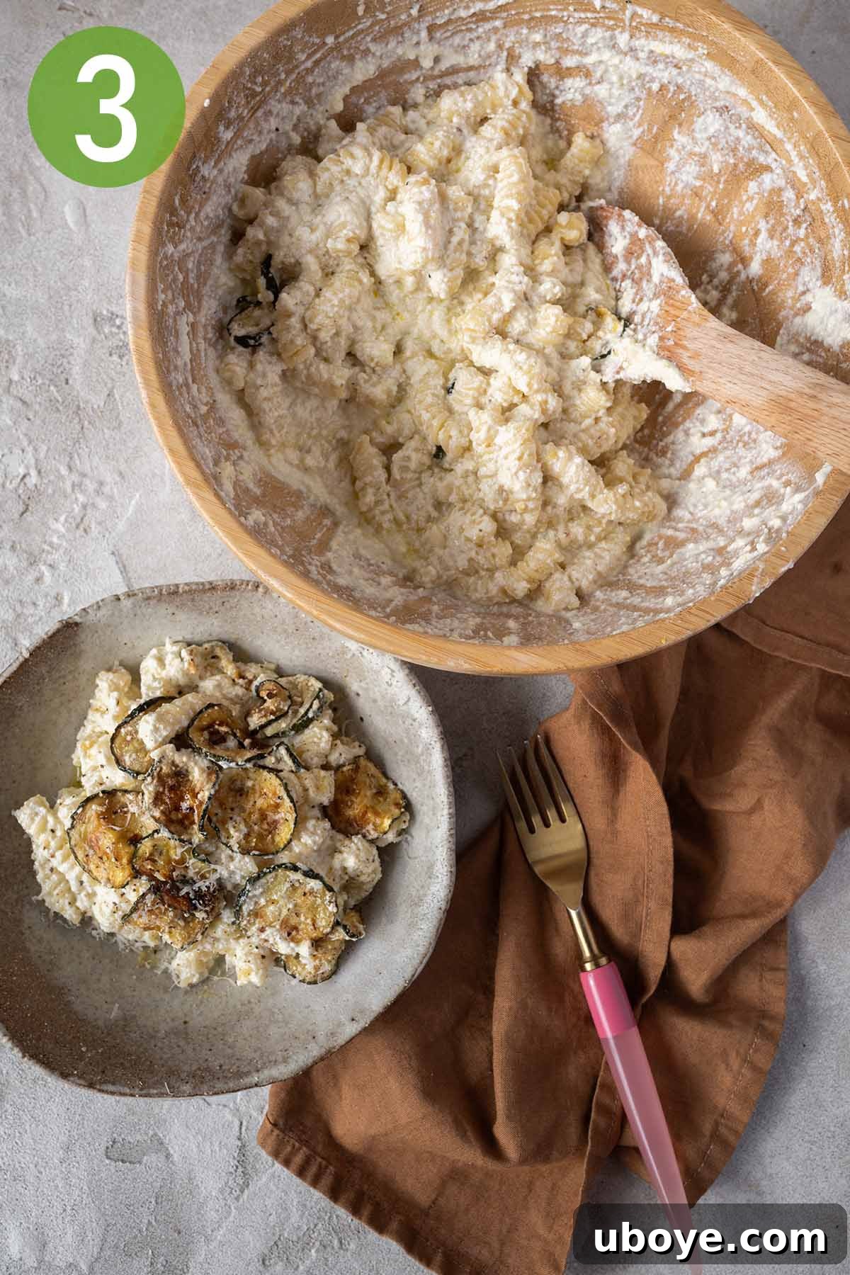 A beautifully plated bowl of lemon ricotta pasta, garnished with extra grated cheese, fresh herbs, and a final drizzle of olive oil, ready to be served.